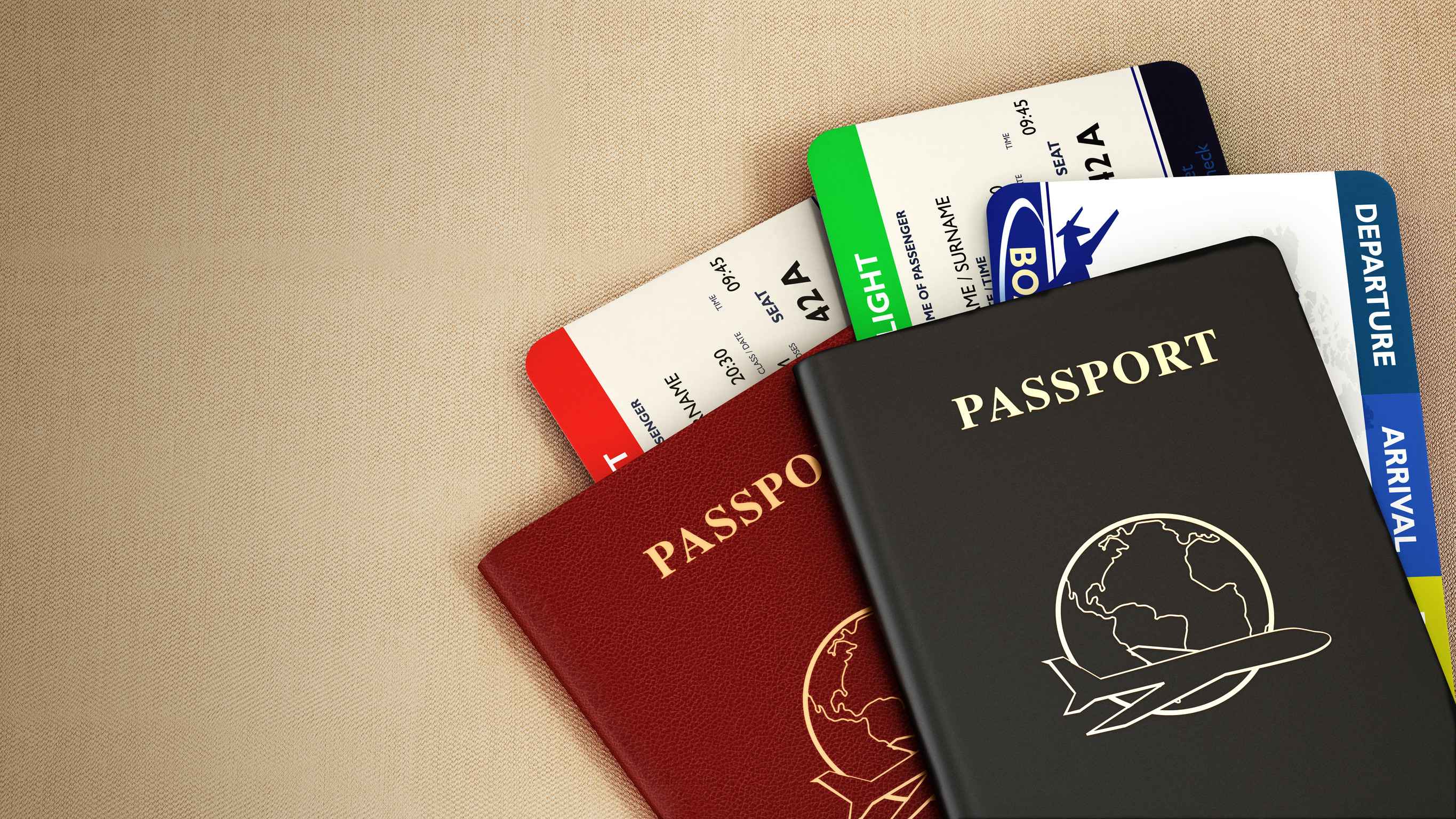 black and red passports and airplane tickets