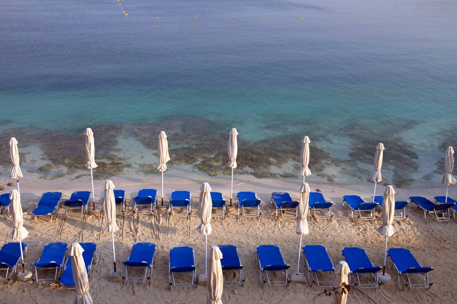 Empty Sunbeds On Ksamil Beach Albania