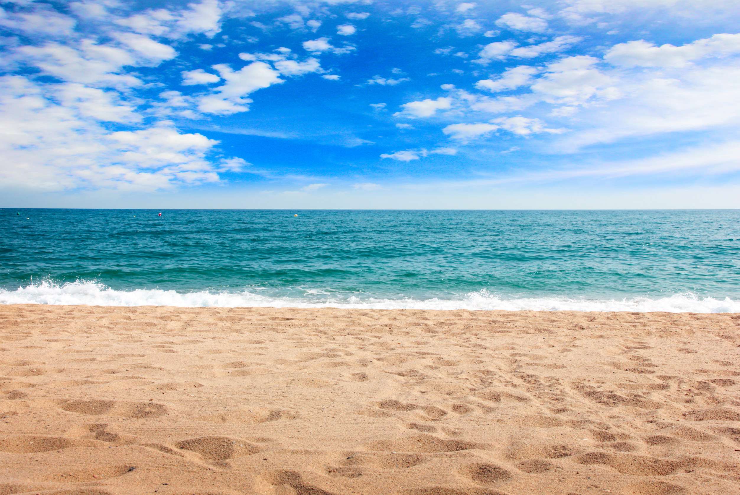 Sandy Beach With Blue Ocean